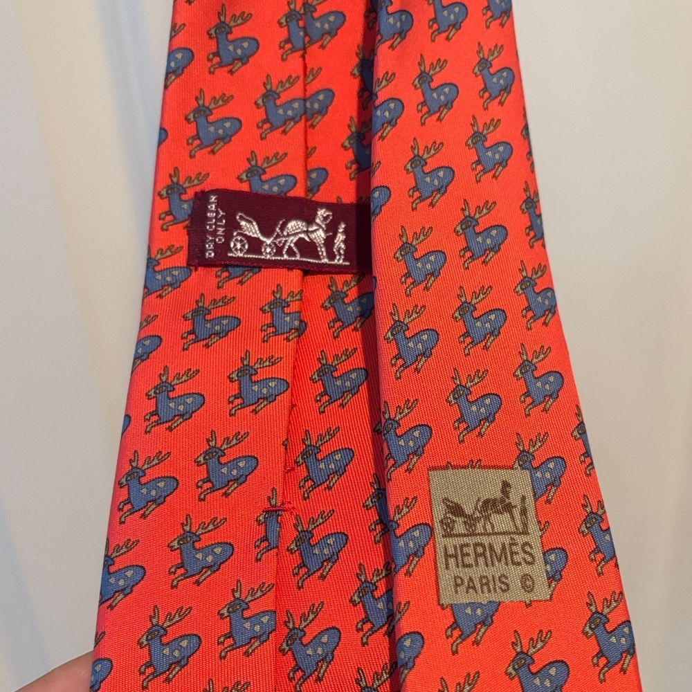 Hermes Vibrant Orange Tie with Blue Reindeer Pattern